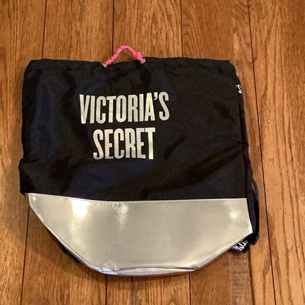 VICTORIA’S Secret black and silver backpack.